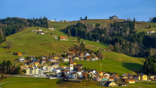 High angle view of houses on landscape against sky