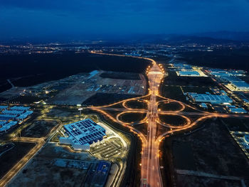 High angle view of illuminated buildings in city at night