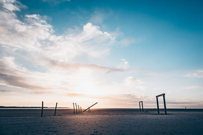 Scenic view of beach against sky during sunset