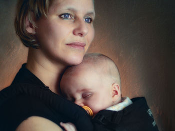 Portrait of happy mother with baby