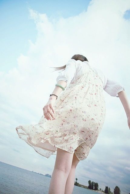 sky, person, cloud - sky, lifestyles, holding, leisure activity, part of, day, cloud, outdoors, cloudy, low angle view, cropped, personal perspective, art and craft, focus on foreground