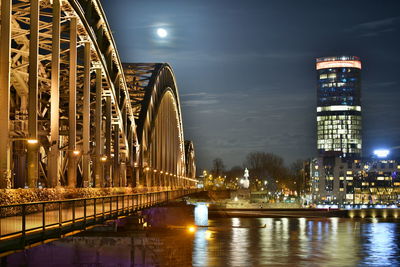 Illuminated bridge at night