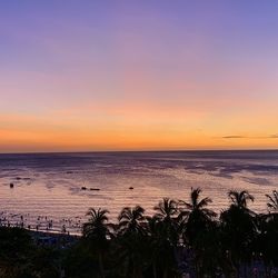 Scenic view of sea against romantic sky at sunset