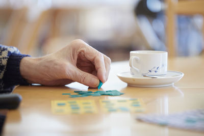 Hand and cup