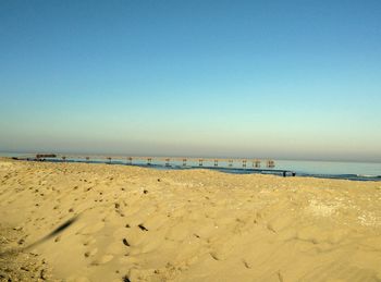 Scenic view of beach against clear sky