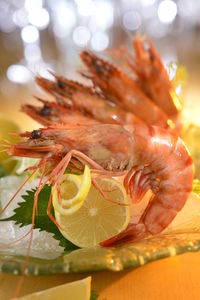 Close-up of fruits in plate on table