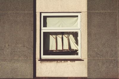 Toy ship on window sill