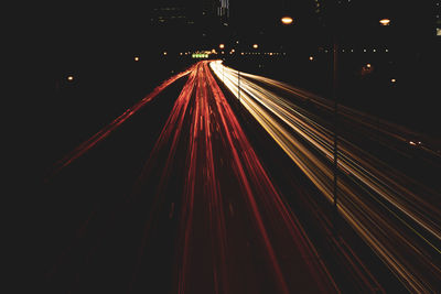 High angle view of light trails on road at night