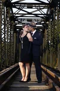 Full length of man standing on railroad tracks