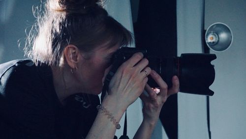 Portrait of woman photographing