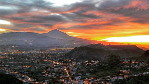 Scenic view of mountains against sky at sunset