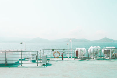 Scenic view of swimming pool by sea against sky
