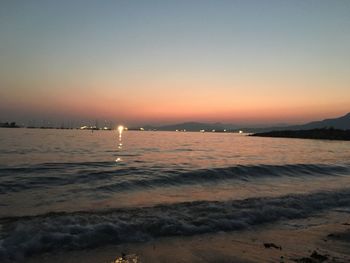 Scenic view of sea against clear sky during sunset