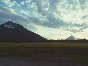 Scenic view of landscape against cloudy sky