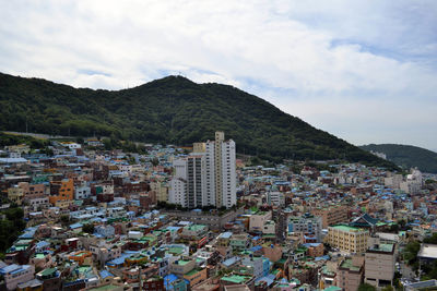 High angle view of buildings in city against sky