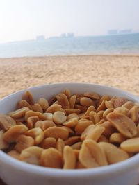 Close-up of eggs in bowl at beach