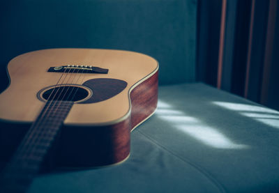 Close-up of guitar on table