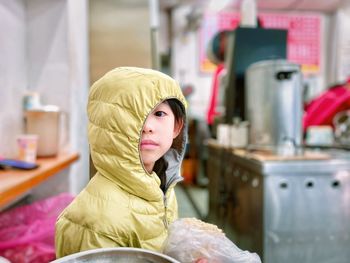 Portrait of smiling young woman wearing mask