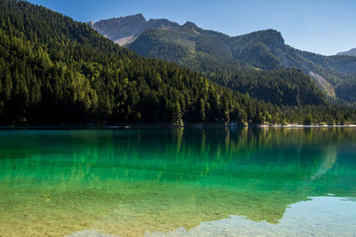 Scenic view of lake and mountains against sky