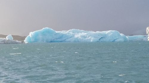 Scenic view of frozen sea against sky