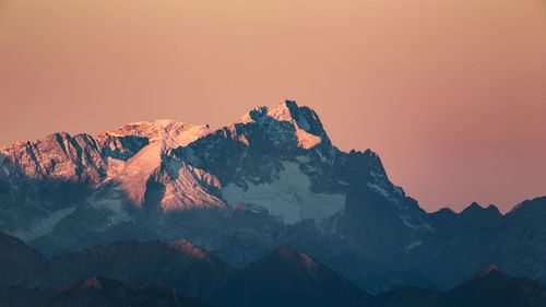 Scenic view of mountains against sky during sunset