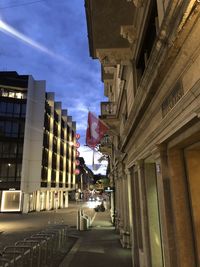 Street amidst buildings against sky in city