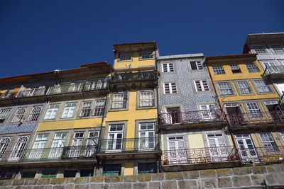 Low angle view of building against clear blue sky