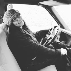 Portrait of woman sitting in car