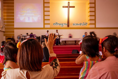 Rear view of people photographing