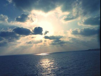 Scenic view of sea against cloudy sky