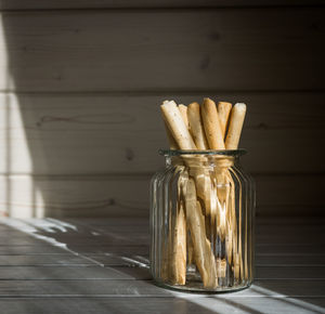 Close-up of glass jar on table