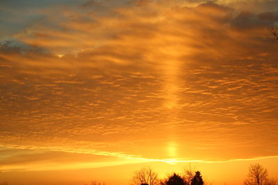 Scenic view of dramatic sky over sea during sunset