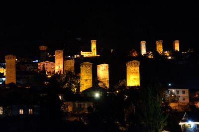 Illuminated buildings in city at night