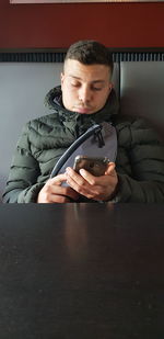 Young man using mobile phone