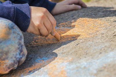 Cropped hand of person preparing food