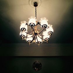 Low angle view of chandelier hanging from ceiling