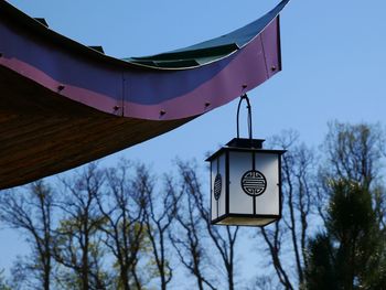 Low angle view of lantern against clear sky