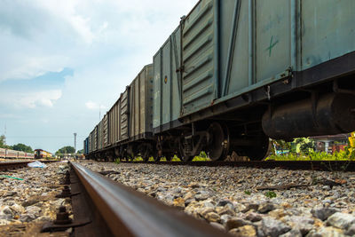 View of train on railroad track against sky