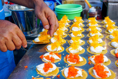 Midsection of person preparing food on table