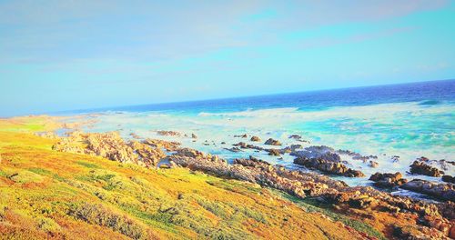 Scenic view of sea against blue sky