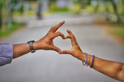 Cropped image of hands forming a heart