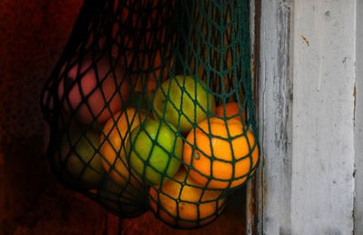 Close-up of multi colored balls in basket