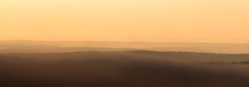 Scenic view of landscape against sky during sunset