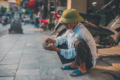 Man working on mobile phone