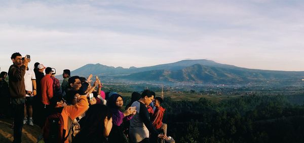 Tourists on mountain landscape