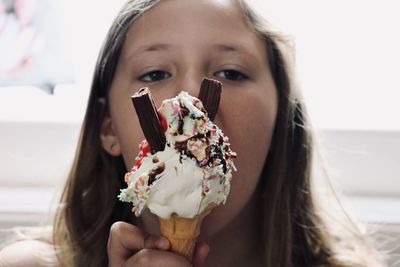 Portrait of woman holding ice cream