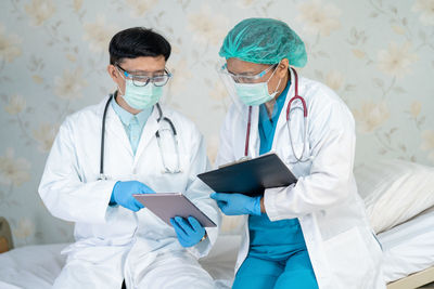 Doctor examining patient in hospital