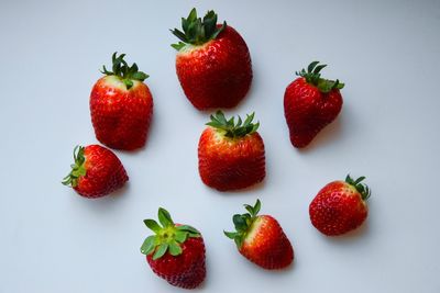 Close-up of strawberry over white background