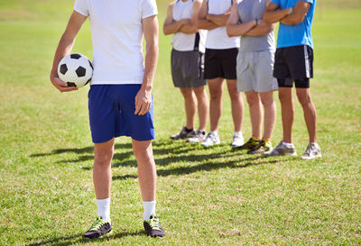 People playing soccer on field