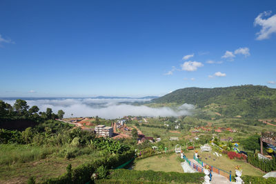 High angle view of trees and buildings against sky